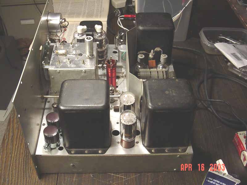 Figure 3 — A DX-100B interior before work: original wiring, original electrolytics, original everything. Nothing here should be powered up at full mains voltage.