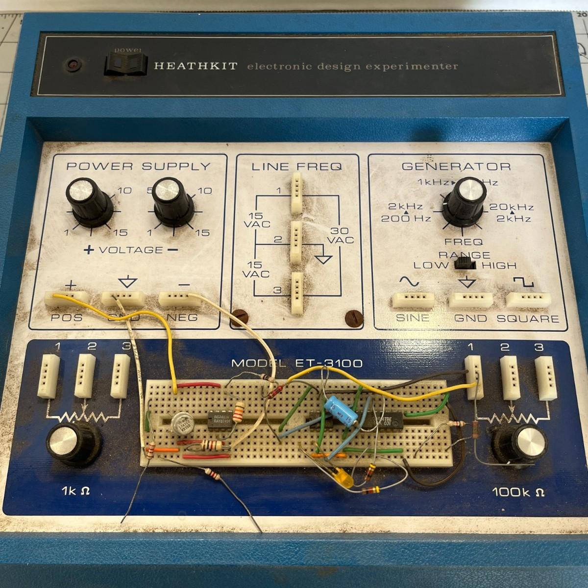 Figure 1 — An original blue ET-3100, seen square-on. Across the top is the pilot lamp, the rocker POWER switch and the "HEATHKIT electronic design experimenter" nameplate; below it the three panels for POWER …