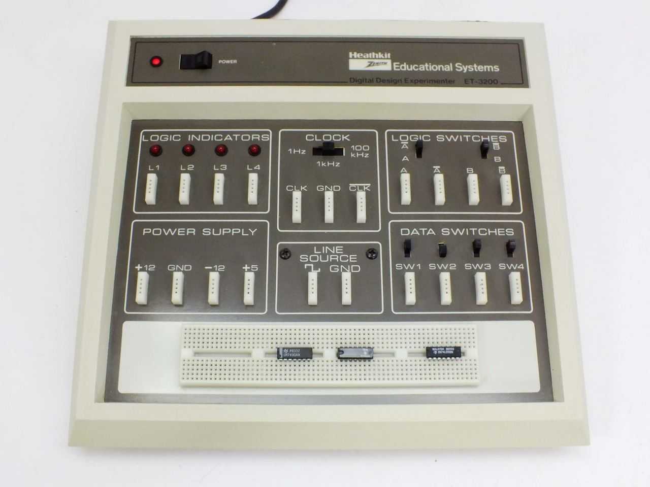 Figure 1 — An ET-3200 in the later Heathkit/Zenith Educational Systems livery: light-grey case, brown silk-screened panel, LED pilot lamp. From left to right and top to bottom the panel carries the four logic…