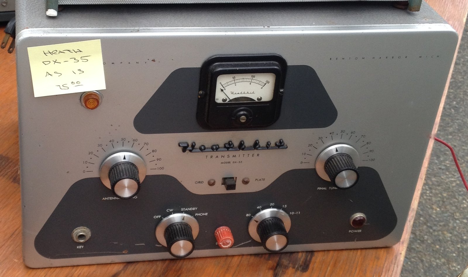 Figure 10 — A DX-35 at a flea market, still carrying its price tag. The black-and-grey "Heathkit" panel with the meter set in a raised escutcheon is the house style of Heath's mid-1950s transmitters.