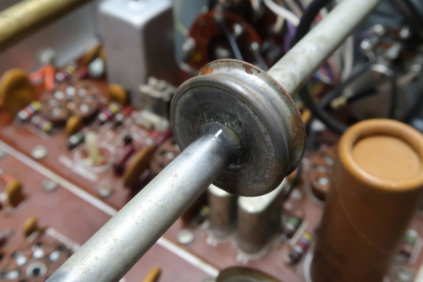 Figure 7 — The repaired drum, set with epoxy and beaded around the rim. Not original, but stronger than the original and reversible in the sense that matters: nothing else was altered.