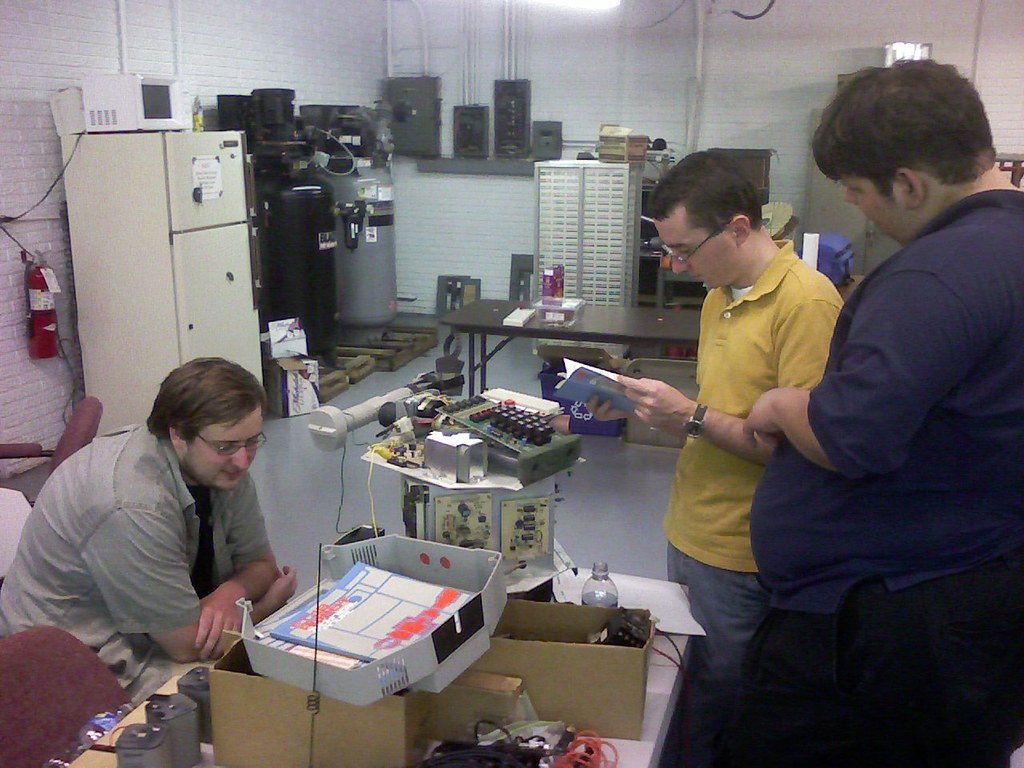 Figure 4 — A HERO 1 on a workbench among its owners, 2008. Restoration in this community is usually a group activity, with parts, ROM images and advice passed along the mailing lists.