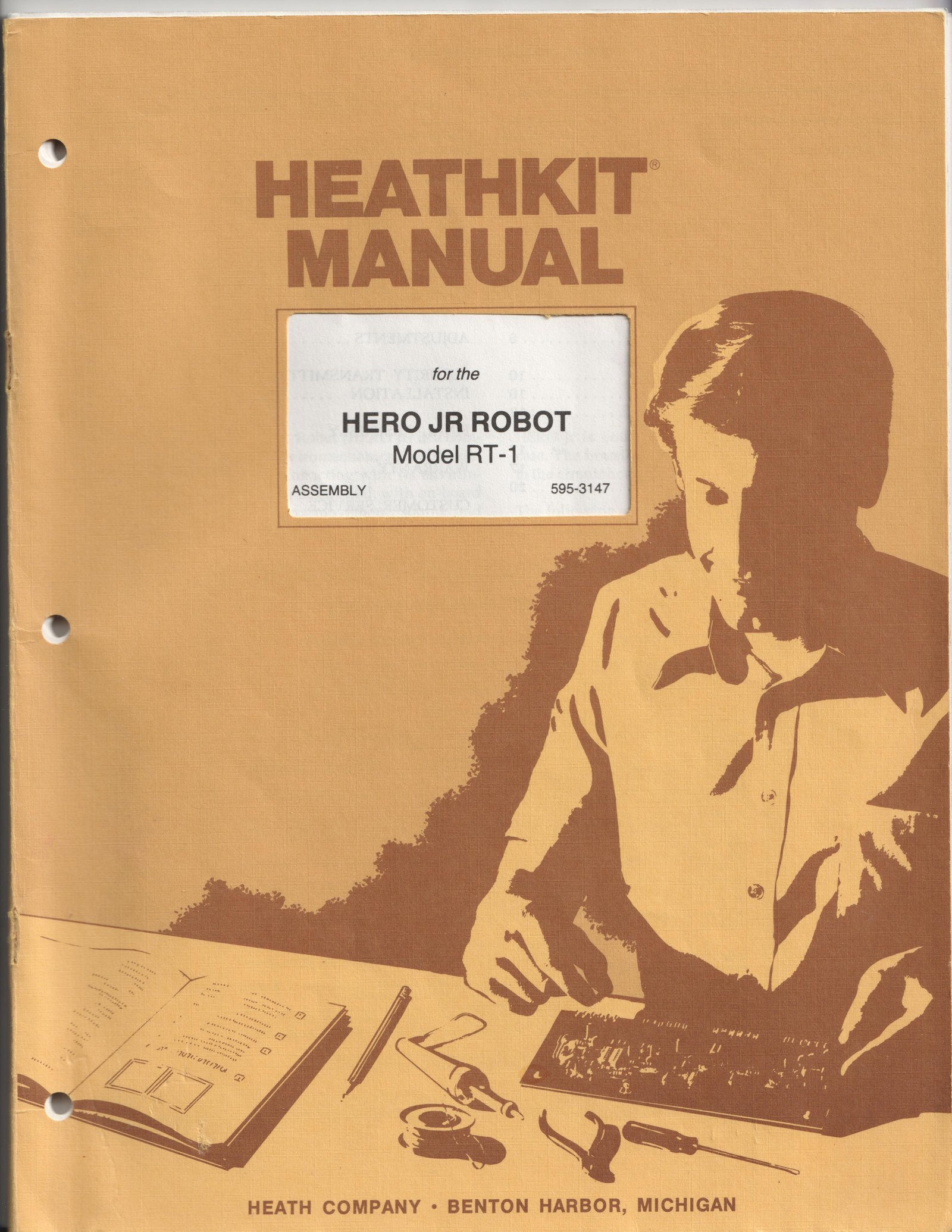 Figure 6 — The cover of the HERO Jr assembly manual, Heath part 595-3147, in the standard Heathkit manual style of the 1980s: a pen-and-ink builder at a kitchen table.