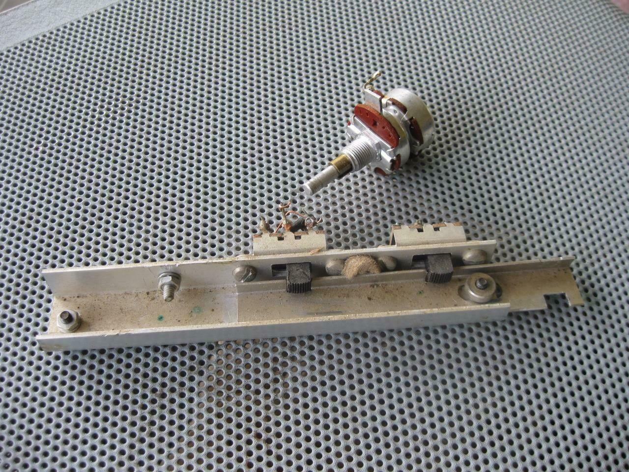 Figure 7 — The SSB/CW filter switch assembly from an SB-101 or SB-102 parts chassis: the RF GAIN control with the lever that works the filter slide switches, on its mounting bracket. The restoration manual us…