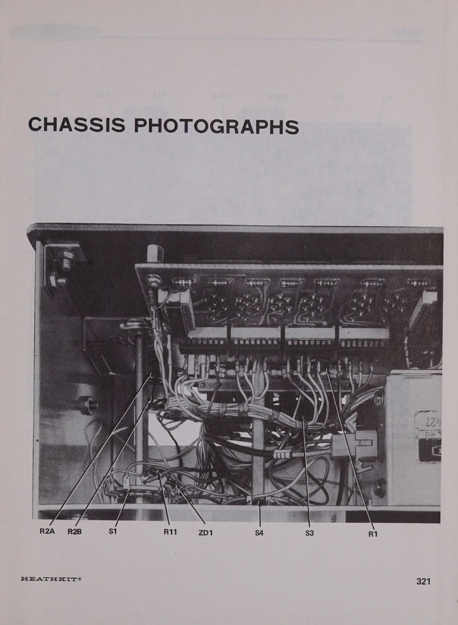 Figure 8 — The first of the Operation manual's chassis photographs, looking into the front of the chassis behind the panel: the control shafts, the rows of chassis pins that the plug-in boards sit on, and the…