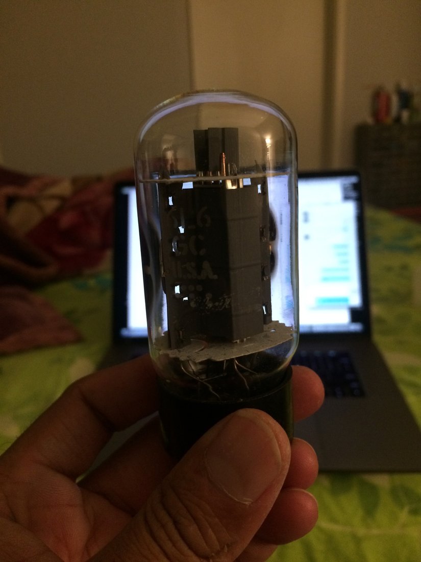Figure 3 — A 6L6GC beam-power pentode — the series-pass device used as V2 and V3 in the SP-2717A's regulator, shown lit and glowing in its socket. Photo: lazyelectrons.wordpress.com.