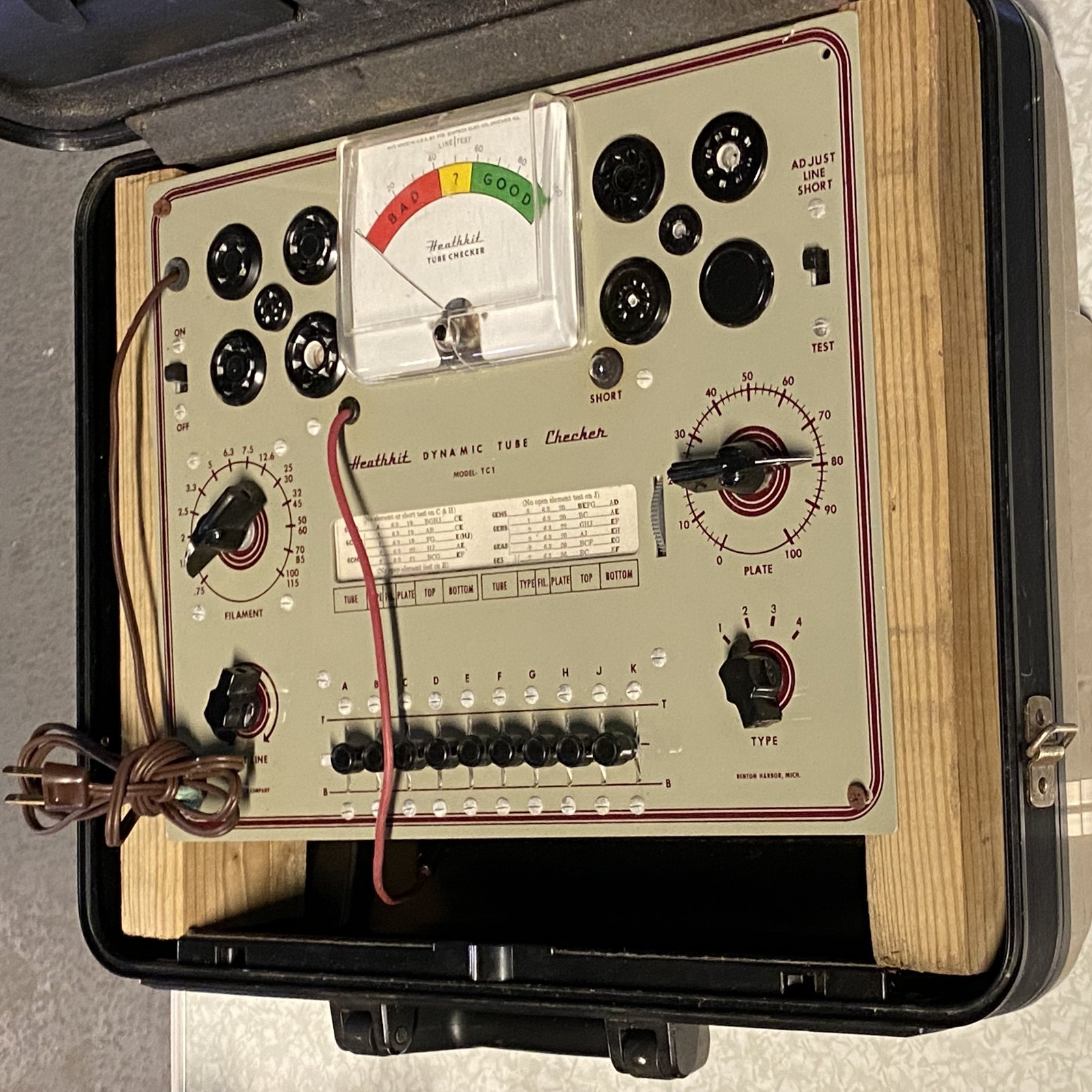 Figure 8 — A surviving TC-1, panel lettered "Heathkit Dynamic Tube Checker Model TC1", in its wooden case at the MIT Flea Market. The maroon-on-cream panel is typical of Heath's earliest instruments.