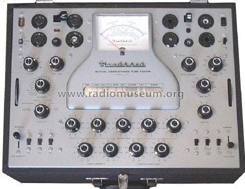 Figure 1 — The TT-1 front panel: "Heathkit MUTUAL CONDUCTANCE TUBE TESTER," the large illuminated meter, the built-in roll-chart window, the bank of per-pin selector switches, and the sockets. Photo: radiomus…